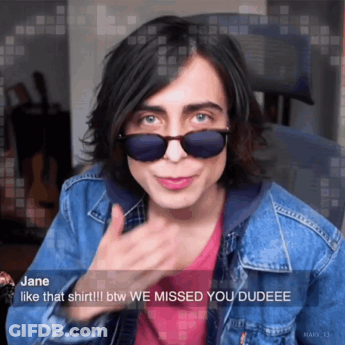 Girl In Sunglasses And Denim Jacket Saying Missed You GIF