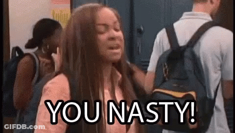 A Girl With A Backpack Is Standing In Front Of A Group Of People . GIF