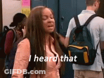 A Girl With A Backpack Is Standing In Front Of A Group Of People And Saying `` I Heard That '' . GIF