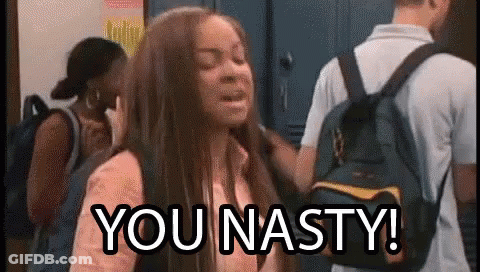 A Girl With A Backpack Is Standing In Front Of A Group Of People And Says `` You Nasty '' . GIF