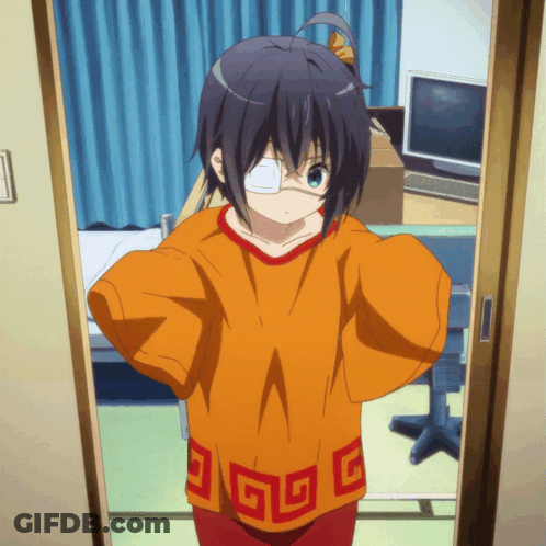 A Girl With A Bandage On Her Eye Is Standing In A Doorway Wearing An Orange Shirt With Chinese Symbols On It GIF