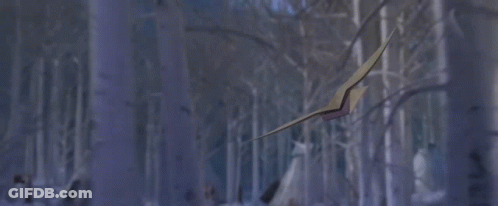 A Girl With A Bird On Her Shoulder Is In A Snowy Forest GIF