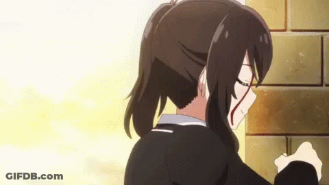 A Girl With A Bloody Face Is Standing Next To A Brick Wall GIF