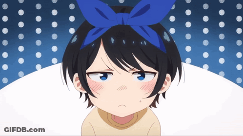 A Girl With A Blue Bow On Her Head Is Making A Face GIF