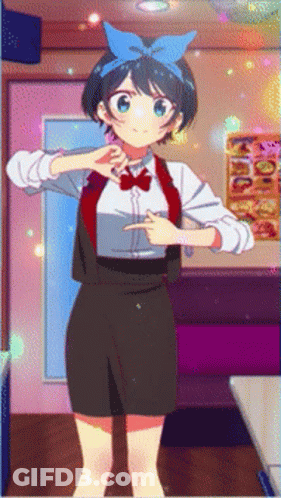 A Girl With A Blue Bow On Her Head Is Pointing GIF