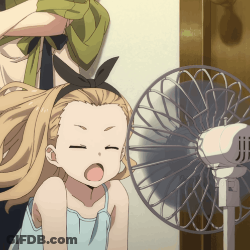 A Girl With A Bow On Her Head Is Looking At A Fan GIF