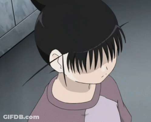 A Girl With A Bun On Her Head Looks Down At Something GIF