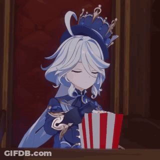 A Girl With A Crown On Her Head Is Holding A Box Of Popcorn . GIF