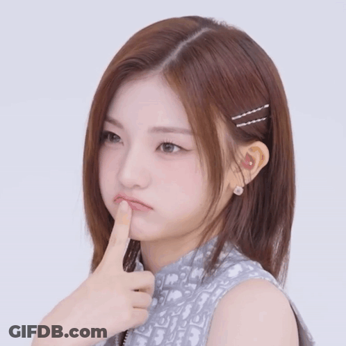 A Girl With A Dior Shirt On Is Making A Face GIF