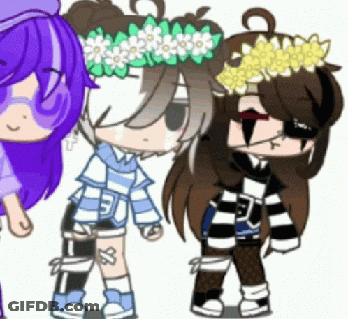 A Girl With A Flower Crown On Her Head Is Standing Next To Two Other Girls . GIF