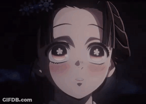 A Girl With A Flower In Her Eye Is Smiling GIF