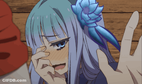 A Girl With A Flower In Her Hair Is Covering Her Face GIF
