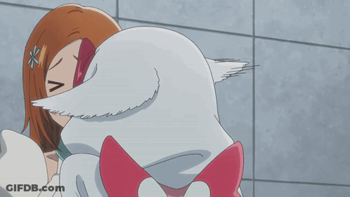 A Girl With A Flower In Her Hair Is Kissing A White Animal GIF