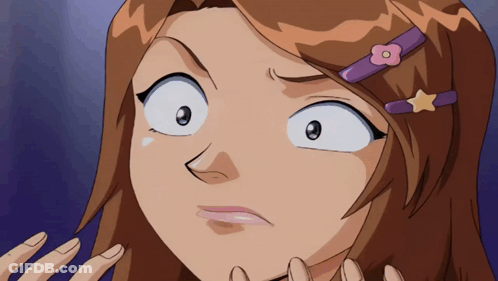 A Girl With A Flower In Her Hair Is Making A Face GIF
