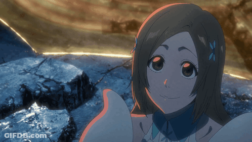 A Girl With A Flower In Her Hair Is Smiling And Looking At The Camera GIF