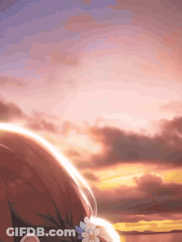 A Girl With A Flower In Her Hair Stands In Front Of A Sunset Sky GIF