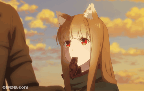 A Girl With A Fox Ear Is Holding A Piece Of Chocolate In Her Mouth GIF