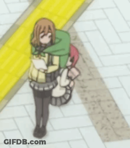 A Girl With A Green Backpack Is Standing Next To Another Girl With Pink Hair GIF