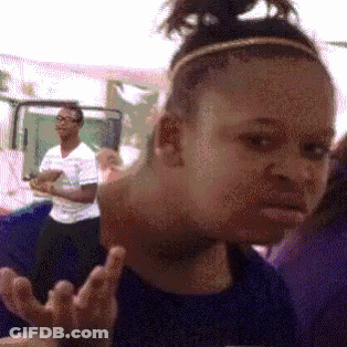 A Girl With A Headband On Her Head Making A Funny Face GIF