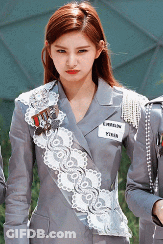 A Girl With A Name Tag That Says Everglow GIF