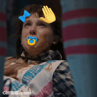 A Girl With A Pacifier In Her Mouth And A Hand On Her Face GIF
