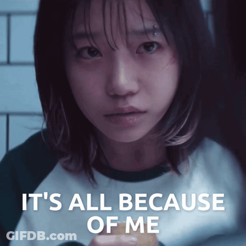 A Girl With A Piercing On Her Forehead Looks At The Camera With The Words It 'S All Because Of Me Below Her GIF