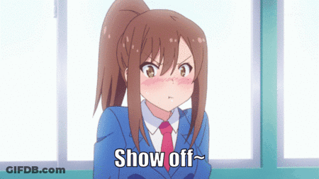 A Girl With A Ponytail And A Blue Suit Says Show Off GIF