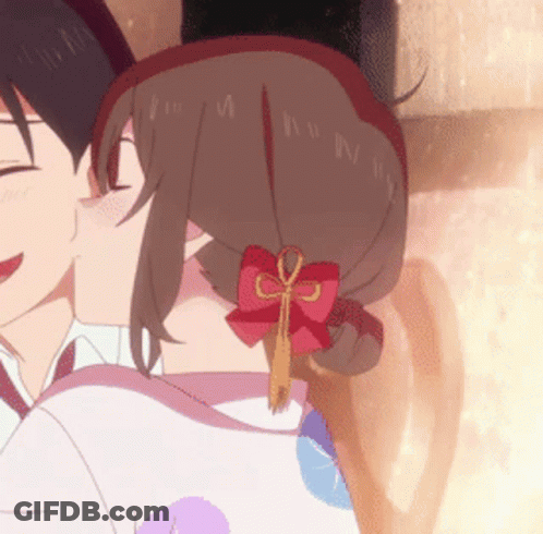A Girl With A Red Bow In Her Hair Kisses A Boy GIF