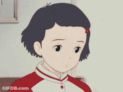 A Girl With A Red Flower In Her Hair Is Sitting In A Chair GIF