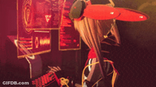 A Girl With A Red Scarf Around Her Neck Is Standing In Front Of A Monitor GIF