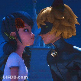 A Girl With A Rose In Her Hair Is Looking At A Man In A Cat Suit GIF