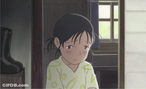 A Girl With A Sad Look On Her Face Stands In A Doorway GIF