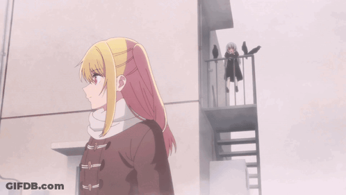 A Girl With A Scarf Around Her Neck Has The Letter S On It GIF