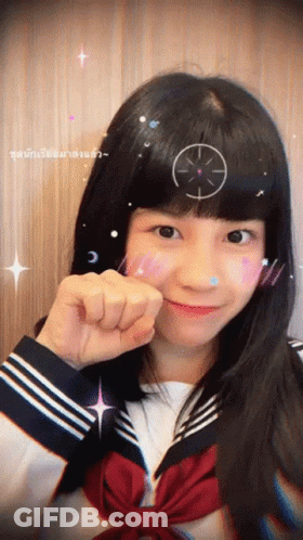 A Girl With A Target On Her Head Is Wearing A Sailor Suit GIF