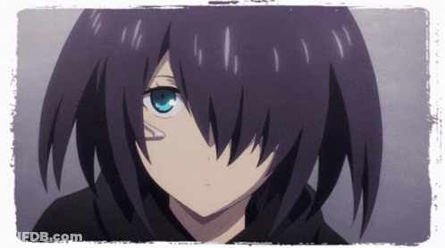 A Girl With Black Hair And Blue Eyes Looks At The Camera GIF