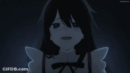 A Girl With Black Hair And Wings Is Smiling In A Dark Room GIF