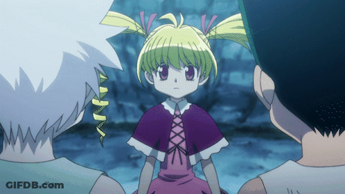 A Girl With Blonde Hair And A Purple Cape Stands Between Two Men GIF