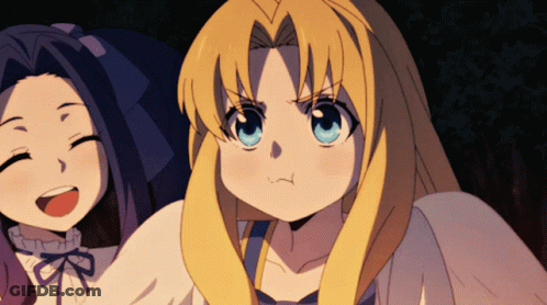 A Girl With Blonde Hair And Blue Eyes Is Making A Face GIF