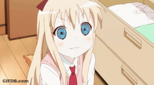 A Girl With Blonde Hair And Blue Eyes Is Sitting Next To A Drawer GIF
