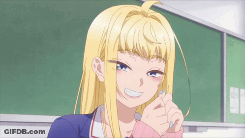 A Girl With Blonde Hair And Blue Eyes Is Smiling In Front Of A Green Board GIF