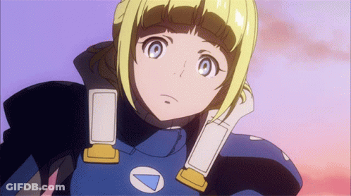 A Girl With Blonde Hair And Blue Eyes Is Wearing A Blue And Yellow Outfit With A White Triangle On The Chest GIF