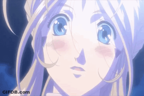 A Girl With Blonde Hair And Blue Eyes Looks At The Camera GIF