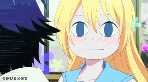 A Girl With Blonde Hair And Blue Eyes Making A Face GIF