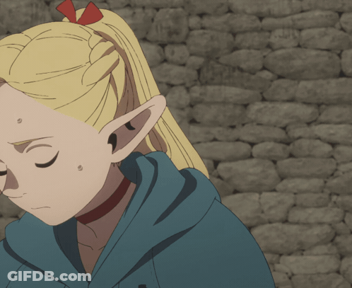 A Girl With Blonde Hair And Green Eyes Is Holding A Cup In Her Hand GIF