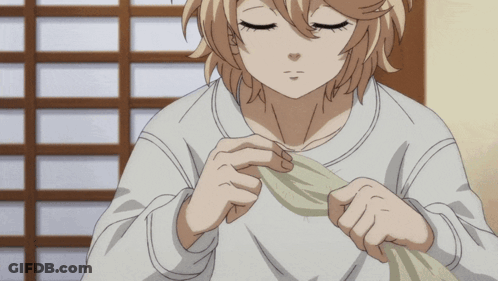 A Girl With Blonde Hair Is Holding A Piece Of Cloth In Her Hands GIF