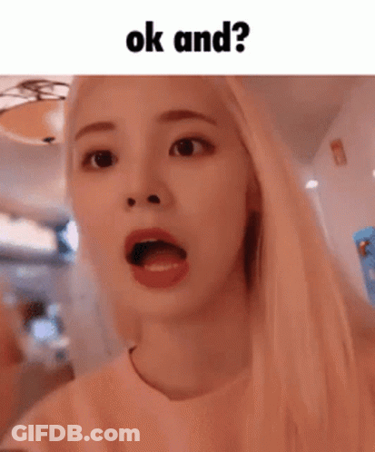 A Girl With Blonde Hair Is Making A Funny Face With Her Mouth Open And The Words Ok And ? Above Her . GIF
