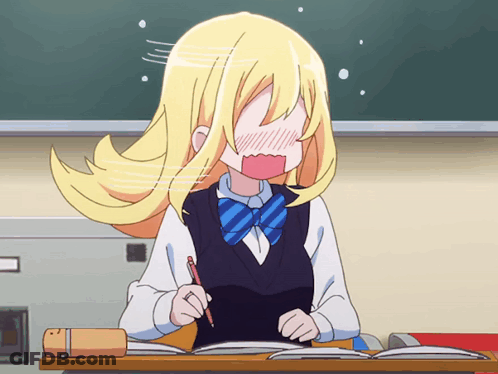 A Girl With Blonde Hair Is Sitting At A Desk Holding A Pen GIF