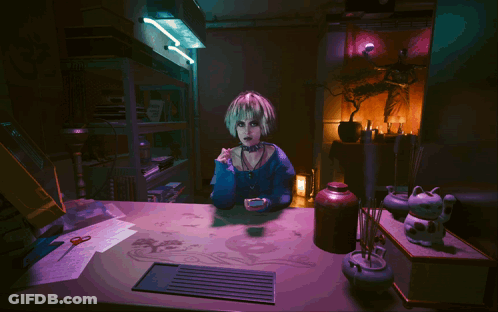 A Girl With Blonde Hair Is Sitting At A Table In A Dark Room With A Purple Light Behind Her GIF