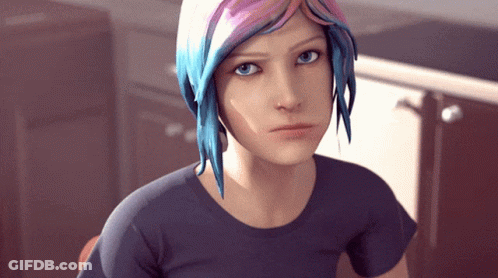 A Girl With Blue And Pink Hair Is Looking At The Camera GIF