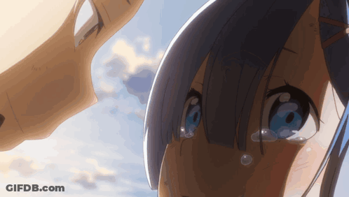 A Girl With Blue Eyes Is Crying While Looking At A Man GIF